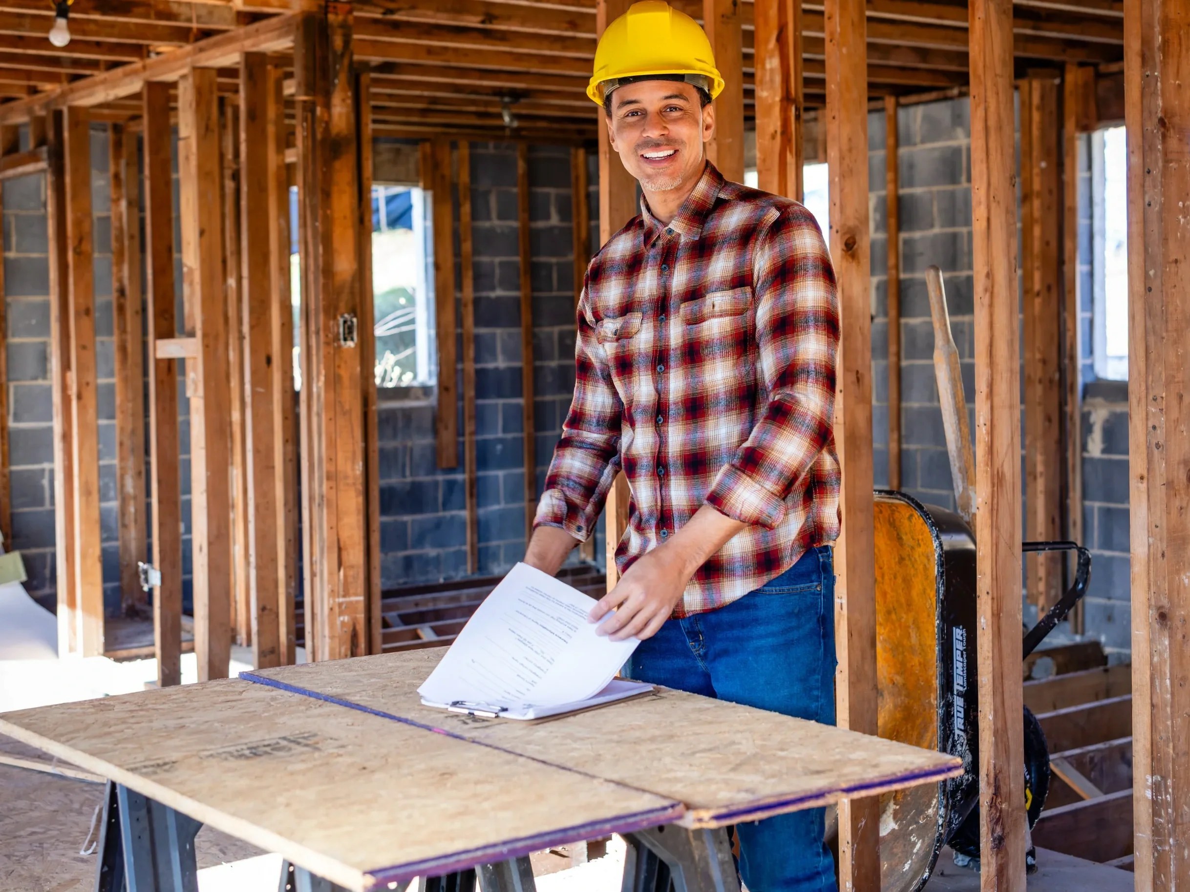 Contractor reviewing plans during a property renovation