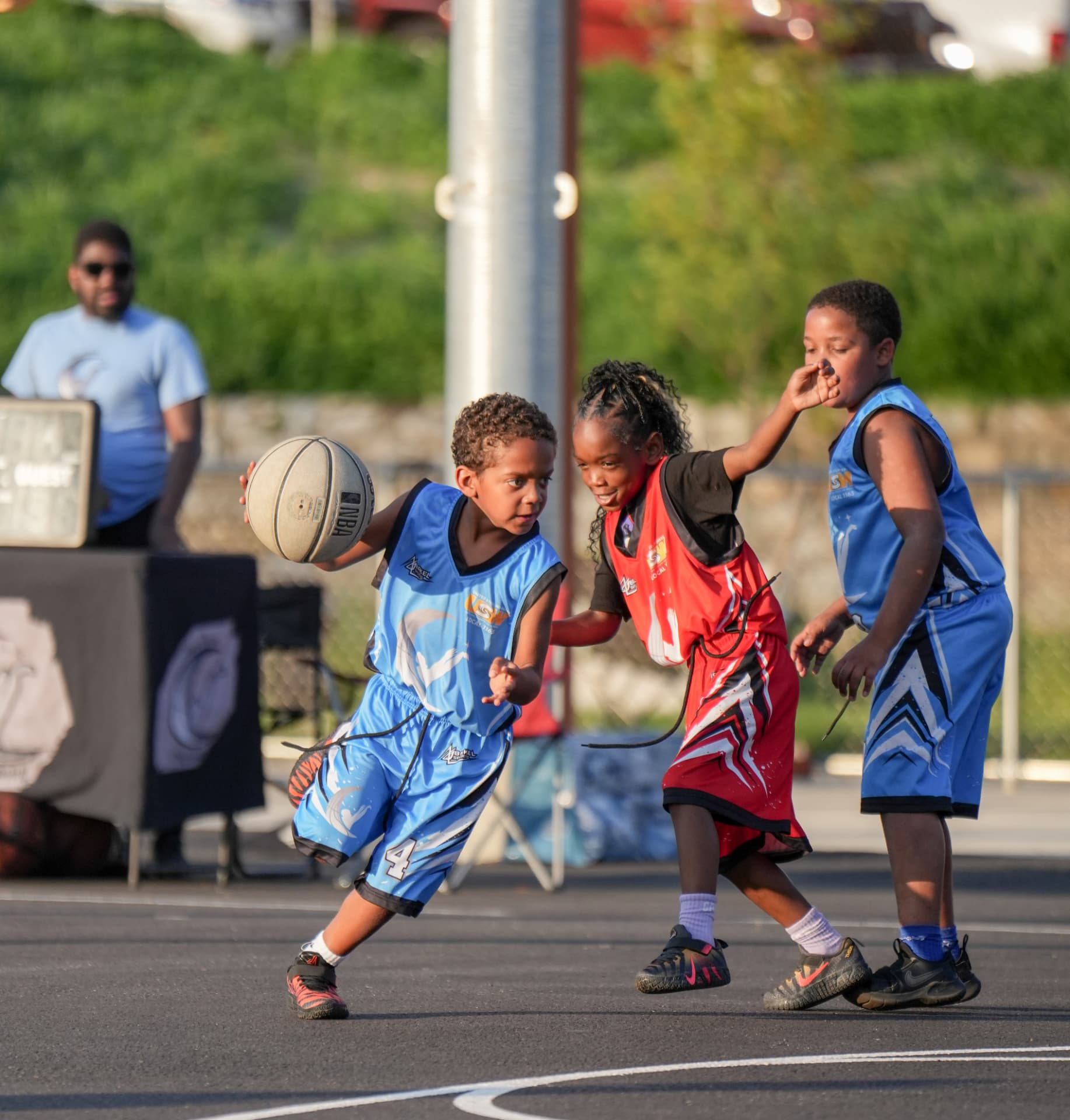Young athletes competing during a Hoop Dreams Academy game